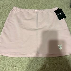 baby pink playboy mini skirt